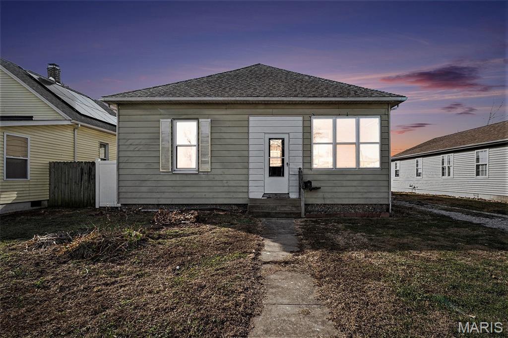 Enter the charm of this 1913-built 3-bedroom, 1-bath home, offering classic character with key modern updates. The kitchen has been refreshed, providing a functional and inviting space for everyday living. The rest of the home offers a great opportunity for cosmetic updates, allowing buyers to add their own style and value. A brand-new roof adds peace of mind, while the large, fully fenced backyard features a concrete patio-perfect for entertaining, pets, or play. Enclosed by a 6-foot vinyl privacy fence. An oversized wooden shed provides ample storage and can also serve as a one-car garage. This home is being sold as is, making it an excellent option for investors or buyers looking to customize a home with solid bones and outdoor space.