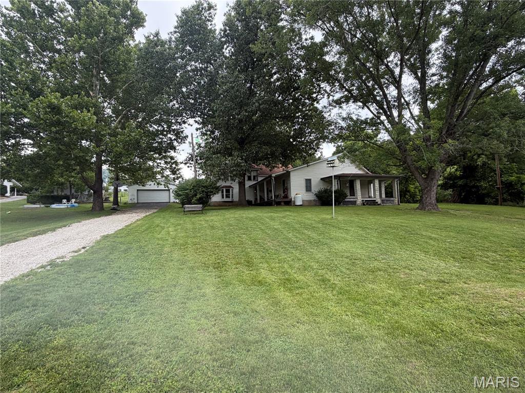 SLOW DOWN AND STEP BACK IN TIME!!   1890's farmhouse on 28+ acres!!  These properties don't come up for sale very often!  Large home with big rooms, nice fireplace in the living room.  Some of the updates have been done for you, and lots of potential to make this home just what you want it to be!  Beautiful acreage and large barn!