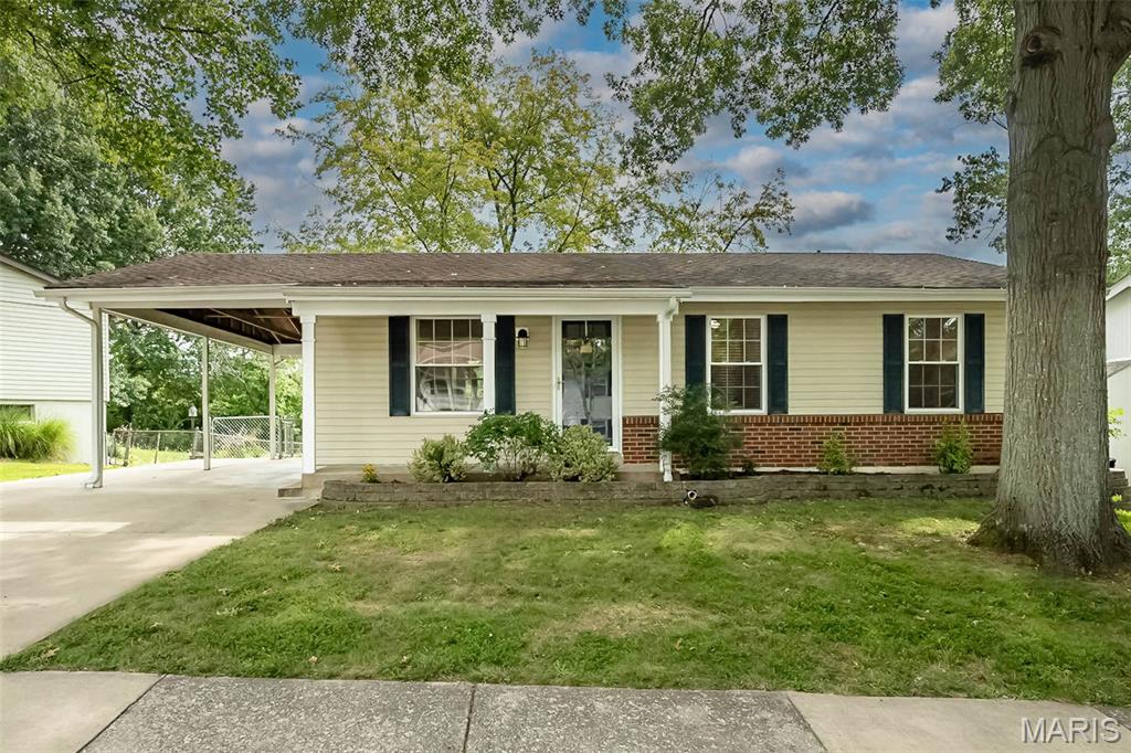 This Fenton charmer is bringing the space, the updates AND a backyard that may seal the deal! NEW KITCHEN, BATHROOM, FLOORING, PAINT ALL IN THE LAST FEW MONTHS! Tucked into a quiet cul-de-sac, this 4-bedroom, 2-bath home pairs a fresh, modern feel with a floor plan that knows exactly how people want to live.

Step inside to an open, light-filled main level where the living room flows effortlessly into a beautifully remodeled kitchen. Crisp white cabinetry, quartz countertops, tile backsplash, stainless steel appliances, stylish black accents and generous storage give this kitchen some serious personality! There’s plenty of room to gather around the table, and the open layout keeps everyone connected whether it’s a quiet Tuesday night or a house full of friends.

Three bedrooms with beautiful hardwood floors and a full bath round out the main level, but we don't stop there! The finished walk-out lower level nearly gives you a second chapter of the home. A spacious rec room is ready for movie nights, game days and weekend hangouts, while the oversized fourth bedroom and private full bath create a fantastic retreat for guests, extended family or anyone who appreciates a little extra separation. Bonus unfinished space offers plenty of room for storage. 

And THEN there’s the backyard. Step out onto the huge party-sized deck overlooking a HUGE fenced yard! There is room for everything; kids, dogs, gardens, backyard games, summer cookouts and the kind of get-togethers that somehow last until dark!

Add covered parking, quick access to major highways, shopping and dining, plus highly sought-after Rockwood School District and this one becomes very easy to say yes to.

Beautifully updated, surprisingly spacious and packed with places to gather, inside and out, don't wait too long to make this one yours!