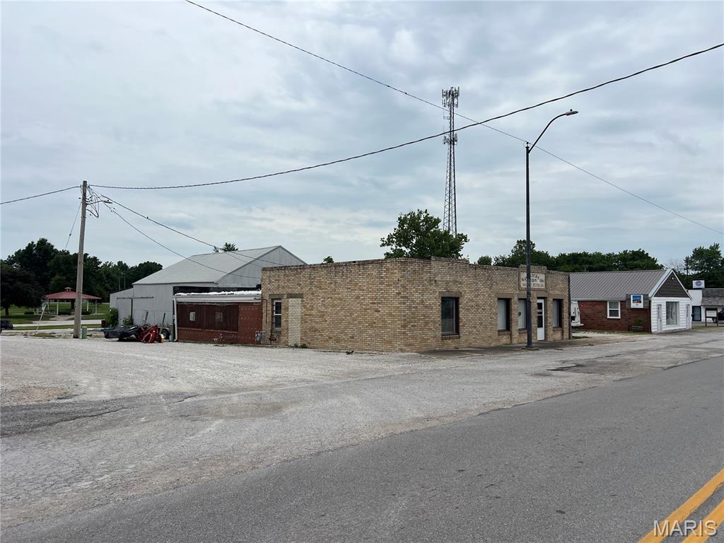 Over 5000 square feet of buildings! Former Ray Oliver and Son Equipment. Building 1 is 2600+/- square feet masonry used as a rental dwelling, building 2 is 2700+/- and used as shop/warehouse extra space for expansion. Bring your imagination and take a look!
