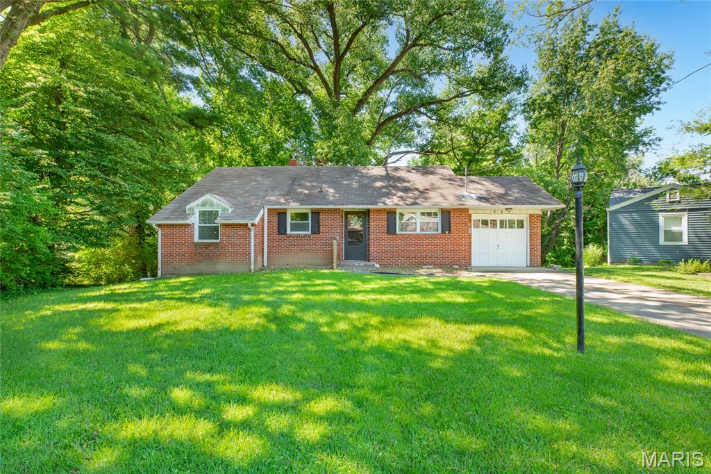 Welcome home to 287 Westwood Place in East Alton!  This 3 bed/1 bath brick ranch is nestled back at the end of a cul-de-sac in a well established neighborhood!  Built in 1950, you'll find this quality built home has hardwood floors throughout most of the main floor living space.  You will love the living room with a cozy gas fireplace and dining area combo that has a wall of windows that overlook a large and private back yard.  The lower level walk-out has a large family room and the third bedroom.  Great layout with plenty of space for all to spread out.  The attached garage and an unfinished utlity area offer extra space for needed storage.  This is a great price point for this charming home!!  Be sure to schedule your private showing soon!  There will be an Open House, Sunday the 14th from 11-1:00, so stop in and see my co-worker, Samantha, who will be hosting!