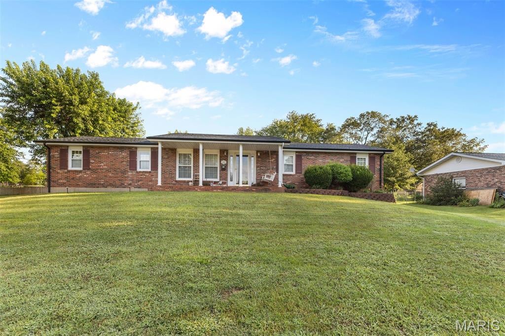 Welcome home to this super cute all-brick 3 bedroom 2 full bath home in one of Farmington's most desirable neighborhoods! Conveniently located near schools and just minutes from downtown, this charming home offers a great combination of character, updates, and everyday convenience. Recent improvements include an updated electrical panel, new insulated garage doors, new architectural shingle roof and gutters, new lighting, updated kitchen and bath flooring, new base trim with crown molding, and fresh interior paint. A new mini-split unit adds additional comfort and efficiency. You'll love the beautiful sunroom, perfect for morning coffee, relaxing or entertaining. Outside, the spacious yard features a new 12 X 16 storage shed, providing plenty of room for lawn equipment, hobbies and extra storage. With its classic brick exterior, thoughtful updates, desirable location, and undeniable charm, this home is truly move-in ready and ready for its next owner!