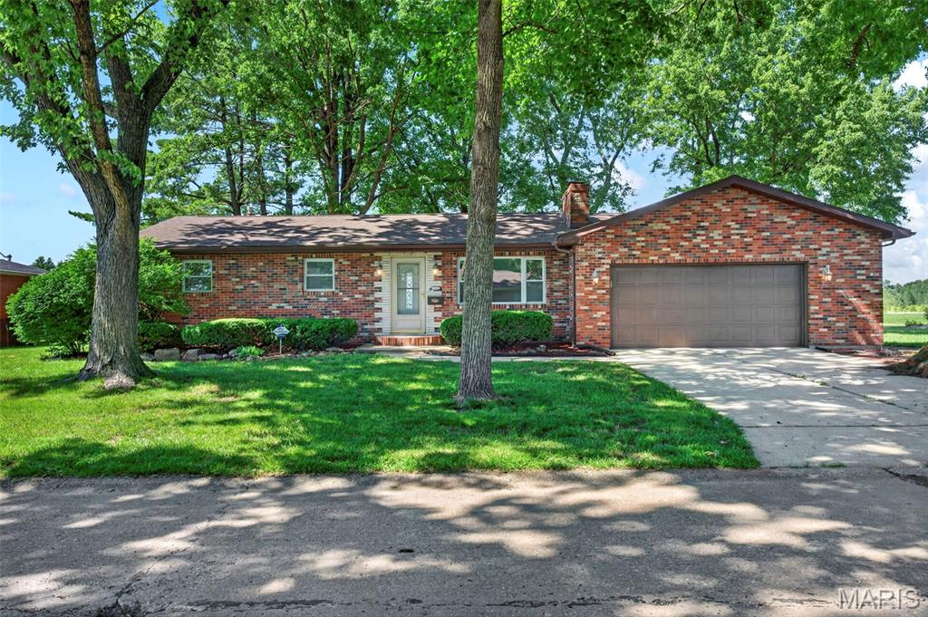 All-brick beauty nestled beneath mature trees with stunning curb appeal, a fully renovated interior, full basement, and—drum roll please—priced at a point that doesn’t break the bank! From the moment you step inside, you’ll appreciate the attention to detail, starting with luxury vinyl plank flooring throughout. The classic wood-burning fireplace anchors the main living space, while the designated dining area flows seamlessly into a beautifully updated kitchen with higher-end finishes that make everyday mealtimes feel elevated. Down the hall, the remodeled bathroom delivers modern chic style with everyday function. Downstairs, the full unfinished basement offers endless potential—storage, laundry, hobbies, or future finished living space.

Set on a beautifully shaded property, this sale includes an additional parcel (17-2-20-03-13-301-004), increasing the total land area to approximately 0.51 acres combined. Whether you're looking for extra yard space, room for recreation, gardening opportunities, or simply added privacy, the bonus parcel is a rare and valuable feature.

Summer evenings are best spent on the spacious composite deck overlooking the backyard. A timeless brick home, updated where it counts, offering over half an acre of combined property, endless potential, and exceptional value—all wrapped into one attractive package.