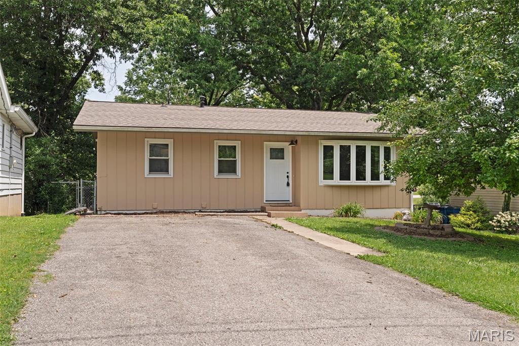 Welcome home! This beautifully updated 3-bedroom, 2-bathroom home is ready for its next chapter. You'll love the refinished original oak hardwood floors, the brand-new kitchen featuring quartz countertops, and the updated full bathroom on the main level.

Downstairs, you'll find a partially finished basement with a spacious family room, a wood-burning fireplace (seller has never used), a second full bathroom, and walk-out access to a large concrete patio overlooking the fenced backyard—perfect for relaxing, entertaining, or letting pets play.

Homes this charming don't stay available for long. Schedule your private showing today and come see everything this home has to offer before someone else calls it home!