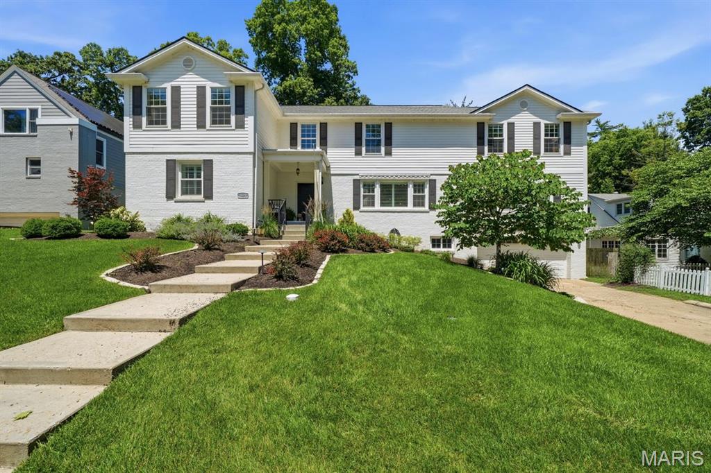 A special opportunity in the sought-after Warson Woods, 1121 Timberlane Drive blends timeless comfort with an impressive collection of thoughtful upgrades designed for today’s buyer. Offering the rare advantage of a main-floor bedroom and full bath, this residence delivers flexibility for guests, multi-generational living, or an ideal work-from-home setup — all within one of the area’s most beloved neighborhoods.

Extensively enhanced inside and out, the property showcases beautifully curated outdoor living spaces, including a stunning paver patio, a renovated deck, professional landscaping, strategic tree removal, front and rear irrigation, improved drainage, and elegant landscape lighting. Interior updates include perimeter drain tile and sump pump systems, updated lighting, custom closets, shutters, and designer window coverings, creating a home that feels exceptionally cared for, highly functional, and completely move-in ready.