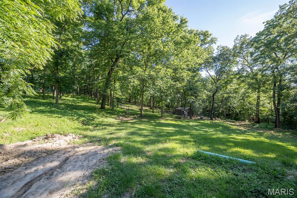 Welcome to this peaceful country property featuring a 3-bed, 2-bath home situated on 3 mostly wooded acres in the desirable Troy School District. Located on blacktop Cuivre Ford Rd with quick access to Hwy 61, this property offers the perfect balance of privacy and convenience, just 12 minutes from the heart of Troy. Built in 1970, the home is surrounded by mature trees and offers ample space for nature, recreation, or expansion. Additional acreage is also available if desired.

Home on 3 acres TBD By Survey. Additional 3 Acres available in the back. This property will need a shared well agreement before closing (Flexible on terms; call for details).