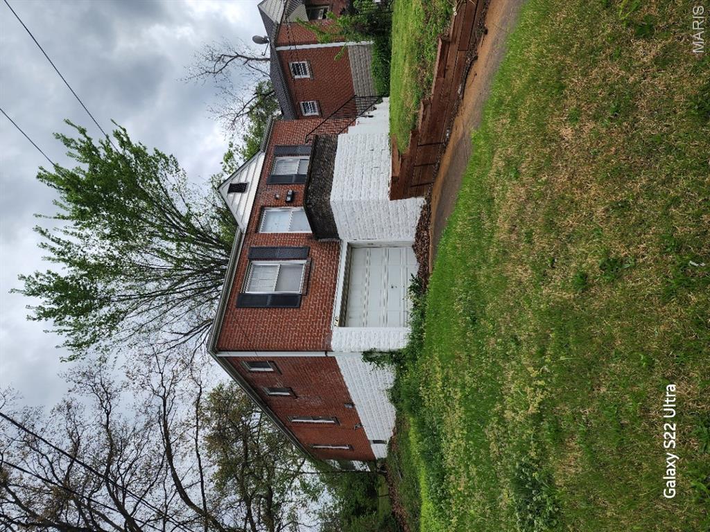 BACK ON THE MARKET...HUGE PRICE IMPROVEMENT!!!  NO sight unseen offers..The buyer will be responsible for the clean-out. This home has tons of potential and is perfect for the investor or handy person looking for a little sweat equity. Owner-occupant buyers could use a 203 (k) loan to make this one their own.  Ready for its new owner!  Living room and Dining room w/ 2-bedroom, 1-bath.  All-brick Bungalow home offers over 1,100 square feet, with a full Bonus room off the kitchen that provides direct access to a large backyard.  A 1-car attached garage tucked into the basement keeps the car protected and provides quick access to the basement area.  Property to be sold AS-IS; seller to perform no repairs or provide any municipal inspections. No inspection contingency. Buyers are to exercise due diligence before submitting any offers. Please submit offers on Special Sale Contract Only.   Close to highways and all of the downtown St. Louis attractions.