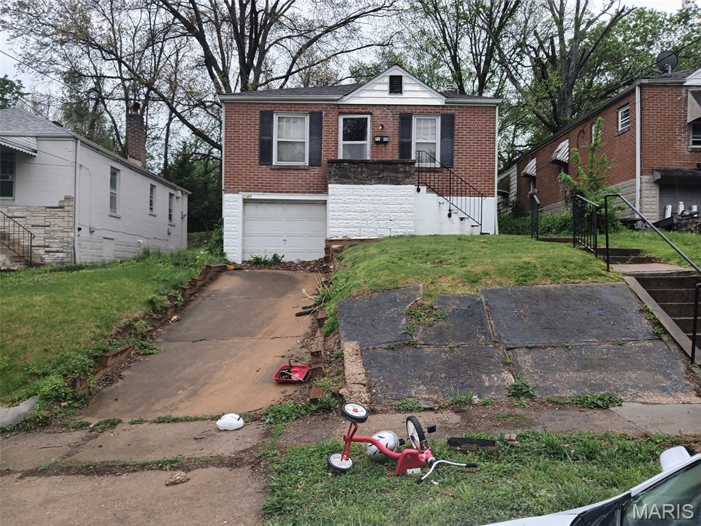 BACK ON THE MARKET...HUGE PRICE IMPROVEMENT!!!  NO sight unseen offers..The buyer will be responsible for the clean-out. This home has tons of potential and is perfect for the investor or handy person looking for a little sweat equity. Owner-occupant buyers could use a 203 (k) loan to make this one their own.  Ready for its new owner!  Living room and Dining room w/ 2-bedroom, 1-bath.  All-brick Bungalow home offers over 1,100 square feet, with a full Bonus room off the kitchen that provides direct access to a large backyard.  A 1-car attached garage tucked into the basement keeps the car protected and provides quick access to the basement area.  Property to be sold AS-IS; seller to perform no repairs or provide any municipal inspections. No inspection contingency. Buyers are to exercise due diligence before submitting any offers. Please submit offers on Special Sale Contract Only.   Close to highways and all of the downtown St. Louis attractions.