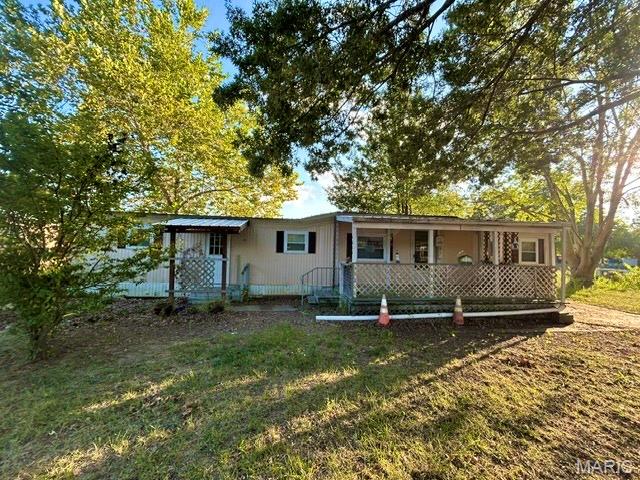 Opportunity for lake living! This 2-bedroom, 1-bath manufactured home sits on a lakefront lot and offers plenty of potential for the right buyer. The property also includes a detached garage and storage shed, providing additional space for vehicles, lake gear, tools, or outdoor equipment. The home is in need of repairs and updating, making it a great option for someone looking for a project, weekend getaway, or affordable lake property to make their own. Property is being sold AS-IS, and the seller will make no repairs. Utilities are currently off. Buyers are welcome to conduct inspections; however, if utilities are required for inspections, the buyer will be responsible for the cost and arrangements to have them turned on. The property is being sold following the owner's passing, and the seller has limited knowledge of the property and its systems. Buyer and buyer's agent should independently verify all information, including property condition, utilities, lake information, and any other items important to the buyer.