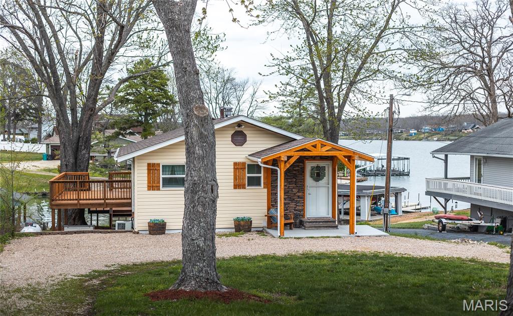 Come see this beautifully remodeled home nestled on the shores of the serene 326-acre Indian Hills Lake. This charming lakefront home offers the perfect blend of comfort and lakeside living. Boasting three beds and two baths, this property is ideal for families or anyone looking to entertain. A large open living room is perfect for a family gathering or that peaceful night in. A bar/game room is located on the main floor with easy access to a full covered porch to enjoy all the views the lake has to offer. Outside, a new boat dock and lift provide easy access to the water, making it perfect for boating, fishing and enjoying all the lake has to offer. Call today to schedule your showing and don't miss the opportunity to own a slice of paradise in Indian Hills.