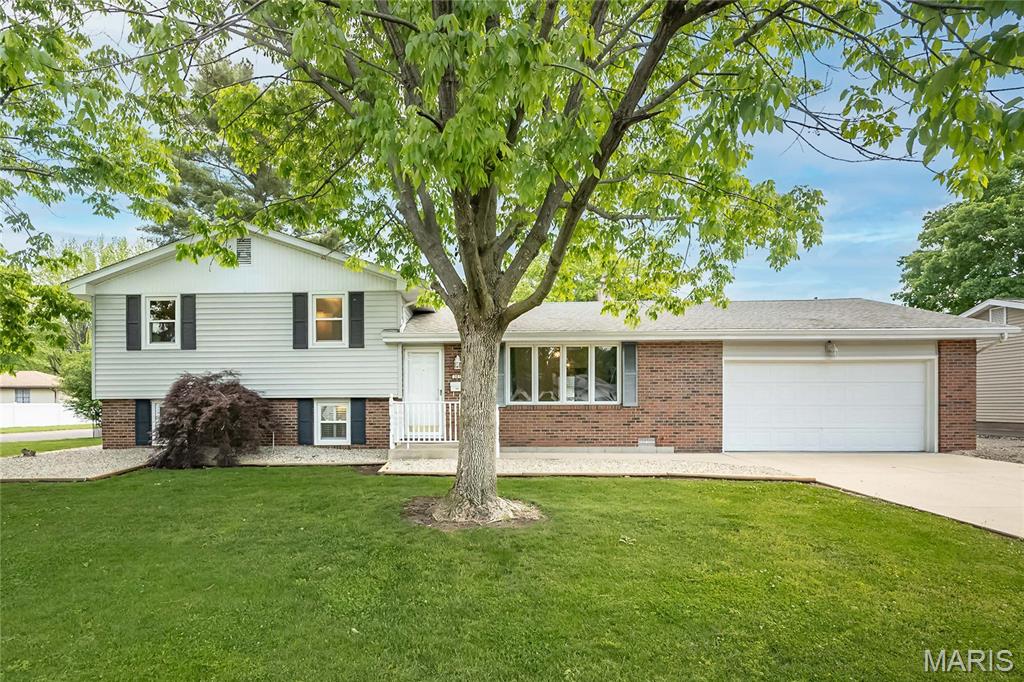 Mid-century tri-level home situated on a desirable corner lot! Enjoy a large, private, fenced backyard featuring two sheds one fully equipped with electricity, perfect for a workshop. The outdoor space is ideal for entertaining with a spacious 40x20 ft patio and an attached 20x20 ft turf area, both separately enclosed with white vinyl fencing.
The oversized, heated two-car garage includes a large storage closet, workbench, and attic storage. The concrete driveway offers additional rocked parking space between neighboring properties, which could easily be converted to asphalt if desired. Fresh landscaping completed in Spring 2026 enhances the home’s curb appeal.
The lower level serves as the primary suite, featuring an oversized bedroom, ample closet space, and a cozy gas fireplace. The full bathroom includes a walk-in shower, and the level also offers a large utility room with abundant storage, a linen closet, and additional storage under the stairs.
On the main level, you’ll find a bright living room filled with natural light, a spacious entryway closet, a dining room with access to the back patio and garage, and a well-appointed kitchen complete with stainless steel appliances and a large black stone sink.
Upstairs offers three generously sized bedrooms, each with ample closet space, along with a second full bathroom featuring an updated tub/shower combo, Roman-style shower, and double sinks at a convenient lower height, plus an additional large linen closet.
Throughout the home, you’ll find updated modern fixtures, new carpet and hardwood flooring, fresh interior paint, and a refurbished patio. Additional updates include a whole-house fan, new HVAC system, and water heater.
With 1,875 square feet of living space, this home provides plenty of room to live comfortably and create lasting memories.