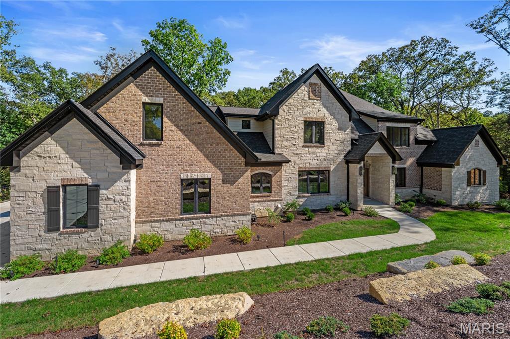 Tucked away on a private drive, this newly built estate offers more than 7,000 square feet of refined living on three wooded acres—just minutes from Chesterfield Valley’s premier shopping, dining, and entertainment. Six bedrooms, five and a half baths, and an oversized four-car garage combine elegance with function. Step outside to a private haven with ample room for play, pets, or the creation of a future poolside oasis—your sanctuary for both relaxation and recreation.