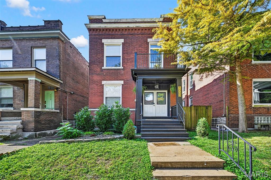 Welcome to this beautifully renovated home in the heart of the highly sought-after Tower Grove East neighborhood! This home perfectly blends historic charm with modern comfort, featuring soaring ceilings, tall baseboards, recessed lighting, custom hand-scraped hardwood floors, and fresh neutral paint throughout.

The spacious open floor plan is perfect for everyday living and entertaining. The updated kitchen features custom  cabinetry, granite countertops, stainless steel appliances, and a breakfast bar. Upstairs, you'll find three generous bedrooms, including a spacious primary suite with an en-suite bath and charming office/reading nook, plus a full hall bath.

Step outside to your private, fully fenced backyard with a large covered porch and ample patio space perfect for relaxing or entertaining. Just a short walk to Tower Grove Park and Crafted, this home puts some of Tower Grove East's favorite spots right at your fingertips. Charming, stylish, and ideally located this one is ready to welcome you home!