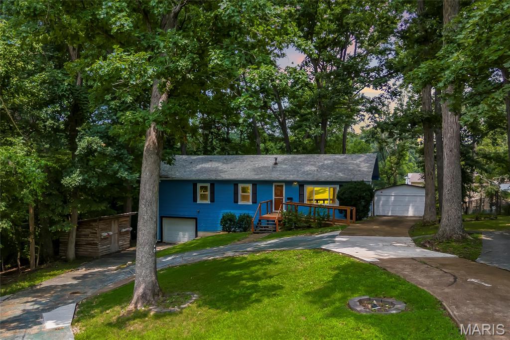 Open Sun, 7/26, 12-2pm. Freshly updated and situated on a tree-lined .67 acre lot with frequent wildlife sightings and no HOA restrictions! This 4-bedroom, 1.5-bathroom home offers a clean, inviting canvas for you to bring your vision to life. The interior features newer thermal paned windows, fresh neutral paint throughout, and all-new flooring - including durable luxury vinyl plank (LVP) and plush new carpeting in three of the bedrooms. Outside, a circle driveway and extensive concrete parking accommodate multiple vehicles. Exceptional utility and storage space is provided by an attached 1-car garage and a detached 2-car garage, perfect for hobbyists or a workshop. A stick-built cedar storage shed offers additional outdoor utility. The property is serviced by a private septic system. Don’t miss out on this rare find!