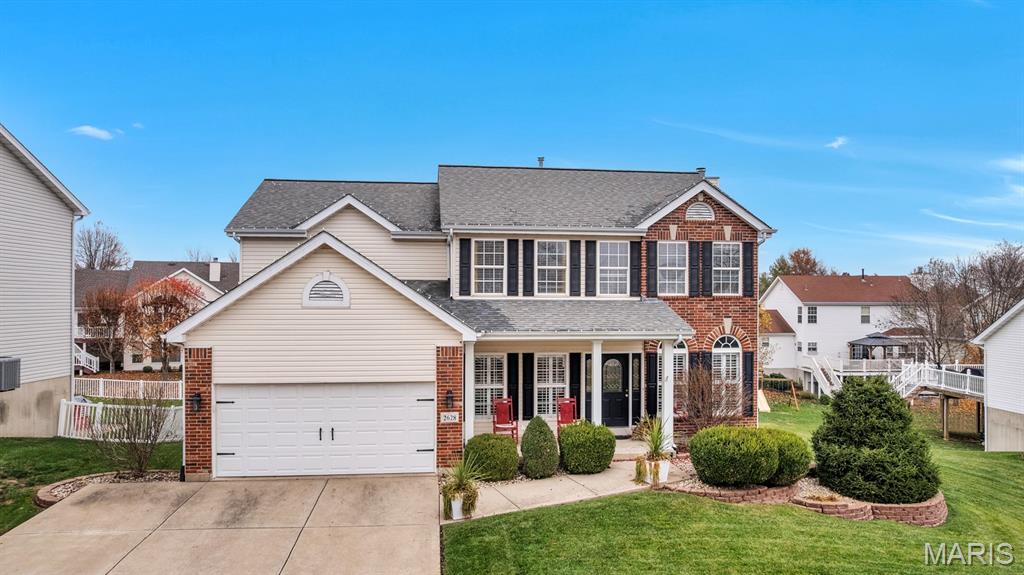This updated 5-bedroom, 3.5-bath home in Hutchings Farm is the kind of place buyers search for and rarely find—space where everyone can spread out, gather together, and truly settle in and a Great price. From the welcoming covered front porch to the finished walk-out lower level, every inch is designed for real life. The main floor flows beautifully with a stately entry, formal dining room for holidays and hosting, a dedicated home office, and a sun-filled great room anchored by a floor-to-ceiling brick fireplace and wall of windows overlooking the backyard. The kitchen is the heart of the home, featuring a large center island, granite countertops, stainless steel appliances, high-end cabinetry, and an oversized walk-in pantry that actually delivers on storage, main floor laundry.  Upstairs, the primary suite feels like a true retreat with a Dream walk-in closet( 10 x 9)  and spa-style bath offering dual sinks, soaking tub, and separate shower. The finished walk-out lower level adds incredible flexibility with space for movie nights, game days, guests, or teens, plus a large pub-style bar with additional bedroom, full bath, and plenty of storage. Outside, enjoy a level backyard, deck, patio, and professionally landscaping, all within a neighborhood that offers a pool, tennis courts, and basketball courts. Conveniently located just minutes from Emge Elementary, Fort Zumwalt South schools, grocery, dining, and everyday essentials—this home truly has it all.
