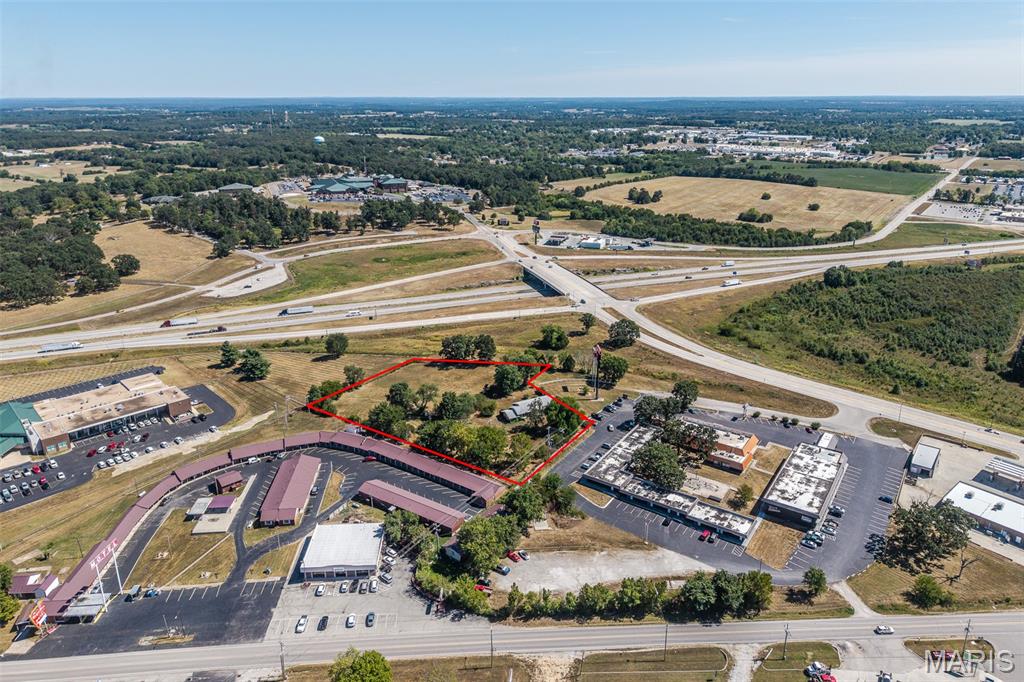 Position your business for success with this 2.6-acre commercial parcel at 1231 Millcreek Rd, Lebanon, MO. Zoned C-1 Commercial, this property offers exceptional visibility and access in a growing corridor. Located just off Elm Street and only seconds from I-44, the site sits near the exit ramp that also serves the hospital — a high-demand area for both local and interstate traffic. Daily counts average 5,500 vehicles on Elm Street and nearly 15,000 along I-44, giving your business unmatched exposure with direct visibility from both routes. With its strategic location and flexible zoning for a commercial endeavor, this property is a strong opportunity for growth and investment.