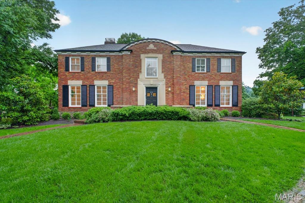 Thoughtfully repositioned, the new price offers room to personalize and opportunity to prosper!
This striking Art Deco residence is beautifully positioned in the heart of desirable LaHacienda subdivision, offering secluded outdoor entertaining spaces and generously scaled interiors complemented by timeless architecture and stylish updates throughout.

A traditional center-hall floor plan seamlessly connects formal and informal living spaces, anchored by a dramatic iron staircase. Gracious gathering rooms are accented by arched doorways, intricate millwork, and expansive windows that bathe the home in natural light.
The updated kitchen features stainless steel appliances, quartz countertops, a charming breakfast nook, a private office, and a powder room.

Upstairs, the spacious primary suite features a rare-for-its-era walk-in dressing room and an expansive bath with a soaking tub and separate shower. Continuing the home’s sense of scale, proportion, and functionality, the second floor also includes an ensuite guest bedroom, two additional bedrooms, and a well-appointed hall bath.
The lower level provides a comfortable family room with a stone fireplace, an oversized laundry room, and direct access to the attached two-car garage.  Outside, lovely patios and an expansive side yard create exceptional spaces for entertaining and relaxing. Ideally located within walking distance to Reed Elementary, Burroughs, and St. Louis Country Club.

A compelling value proposition, this offering has been priced to allow for improvements while supporting a potential future value between $1.25–$1.3 million.