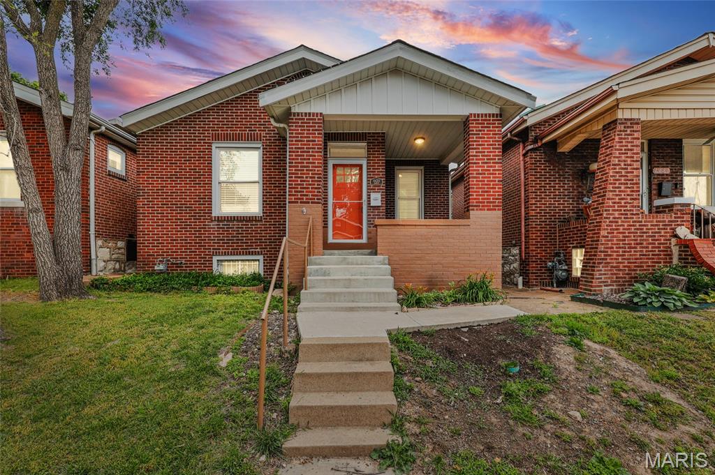 Come check out this beautiful, all-brick bungalow in Bevo Mill. Centrally located in the heart of South City, walkable to favorite local hotspots, and parks. Renovated just two years ago, this home blends the desirable historic charm with the modern updates that buyers actually want. A classic brick exterior and covered front porch make for morning coffee or stoop sitting as you get to know your awesome neighbors or participating in a block party. Adding to the retro vibe, the colorful front door welcomes you into a traditional foyer, adorned with an intricate stained glass window. The bright living room and kitchen connect the bedrooms providing an added degree of privacy while still proximity to your bestie. Off the LR is the first of the two bedrooms. With a decorative fireplace and two, larger windows, natural light radiates through this space making it bright, welcoming, and a cozy place to rest and relax. The well appointed kitchen delivers both style and function with stainless steel appliances, a gas range, white, shaker-style cabinetry, granite countertops, and a pearlescent hex tile backsplash. Off of the kitchen is the second bedroom boasting double closets that provide added storage in a traditional 1900's home where that can sometimes be limited. Original millwork and rich hardwood floors carry throughout, adding warmth and timeless character. A secondary living space just off the kitchen serves as a flex space for use as a breakfast room, home office, or even a playroom. Complete with an exposed brick wall and built-in shelving, this bonus space gives a subtle nod to the period-specific character these homes were known for adding just a touch of personality. Finishing out this main floor is a sizable and centrally-located full bathroom complete with a larger vanity, a wide LED mirror, ceramic tile flooring, black hardware, and the cherry on top: a fully tiled tub and shower combination. Downstairs, a full, walk-up basement, allows for additional storage or the future potential of making it your own. A nice compliment to the tasteful interior; the fenced-in backyard doesn't disappoint with ample green space for kids, pets, or a garden, as well as a coveted one-car garage. A lockable back gate provides added security for your peace of mind and privacy for everyday city living. As if the amenities this home provides isn't substantial enough, enjoy entertaining family and friends from your huge deck, perfect for summer nights or BBQ's. Located within walking distance to Lansdowne Village, Christy Park, and neighborhood shops and restaurants, this home offers both convenience and community. Easy access to I-44, I-55, and public transit. A one-year Choice Home Warranty to be provided by the Seller for the added protection and reassurance a new home buyer may need. Great rental to add to a portfolio or perfect home for a new homeowner. Freshly painted and the basement has been fully tuck-pointed and dry-locked. Occupancy already obtained! All appliances stay.