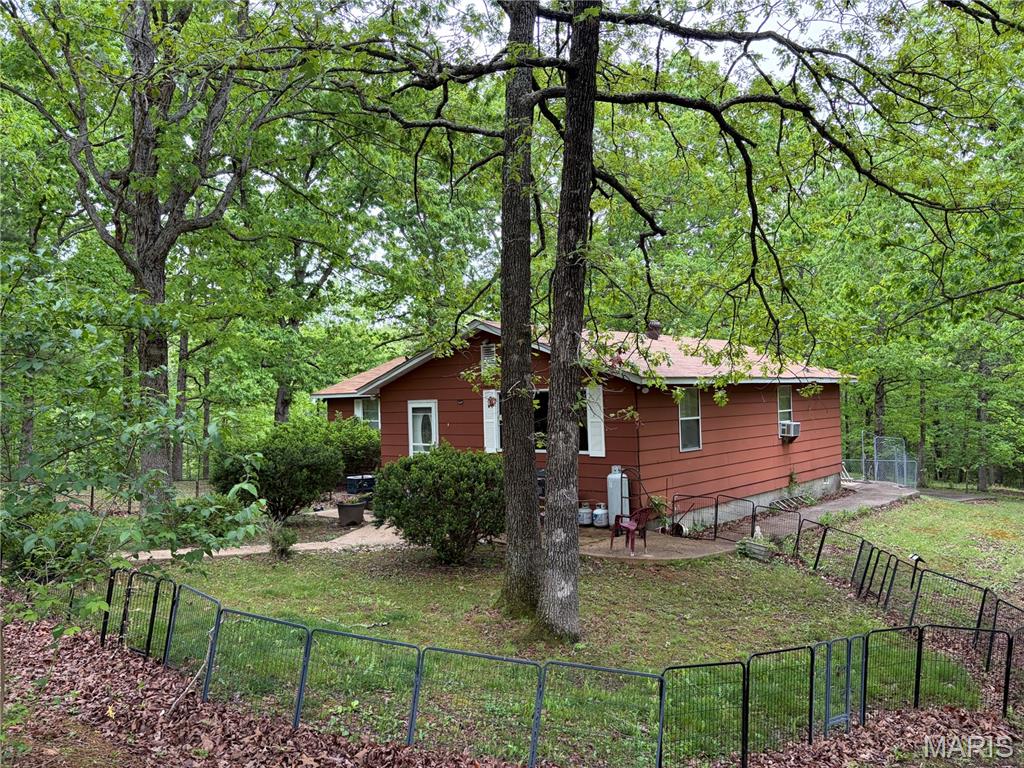 Back on the market due to no fault of the seller! Contact agent with any questions! If you are ready for privacy, this is your home! 2 bedroom, 1 bath home with a large living room and dining/kitchen.  Plenty of room to expand and turn this into your dream property!  This is a nature lovers paradise with a couple ponds and wildlife all around.
