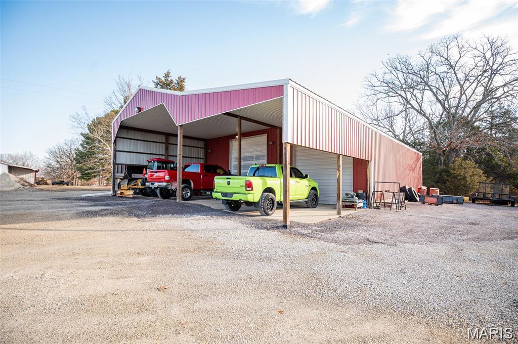 BEAUTIFUL BUILDING SITE!  Nestled in a picturesque 3.4-acre country setting just outside the city limits of Belle, this beautiful future building location offers a serene escape. The expansive acreage boasts open, gently sloping, and wooded areas, providing a tranquil environment.  Deep well and concrete septic tank already installed. 
The huge 44'Wx50'Lx16'ceilings shop is wired and fully insulated. There are a couple 50amp 220v outlets for welders and or air compressor.
The shop includes two large garage doors, measuring 12’x14’ and 12’x11’, providing ample room to accommodate a camper or semi-truck. This unique listing presents endless possibilities for your future endeavors.
Along with the shop is a 14'Wx50'Lx16'T portable carport large enough for camper storage or just about anything else you would need it for.  In the front of the shop is a 44'Wx24'L covered concrete carport.  
Inside the shop, you’ll find a water filtration and softener. Additionally, there’s a sectioned-off room, currently used as a beauty salon, equipped with its own heat and air conditioning Mini Split.  future(Man Cave!) or (She Shed!).
The Mobile Home is SOLD and will be removed before closing!!!