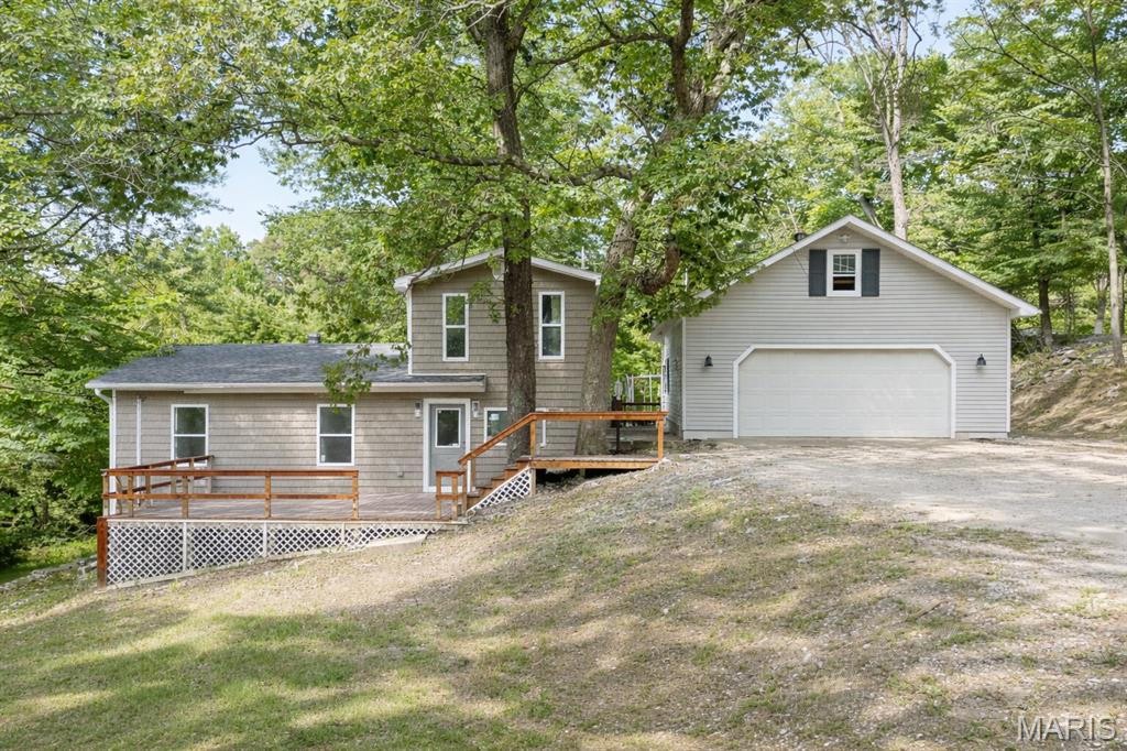 Beautifully Renovated Home on 5 Acres in Caseyville, IL! This fully updated 3-bedroom, 2-bath home offers the perfect blend of modern living and country charm. Situated on 5 acres—with nearly an acre of open front yard—this property features a two-car detached garage with an unfinished loft, a chicken coop, and a greenhouse setup. The extra kitchen sink (not facing window) can be removed and replaced with just a normal countertop if requested. The remaining wooded acreage makes this a dream for outdoor enthusiasts, hunters, and anyone looking to enjoy nature, privacy, and recreation right on their own land. Whether you're hunting, exploring, or simply unwinding outdoors, this property delivers. Enjoy peaceful surroundings while still being just minutes from Scott AFB and all the shopping, dining, and entertainment in Fairview Heights. Buyer or Buyer's agent to verify MLS Info