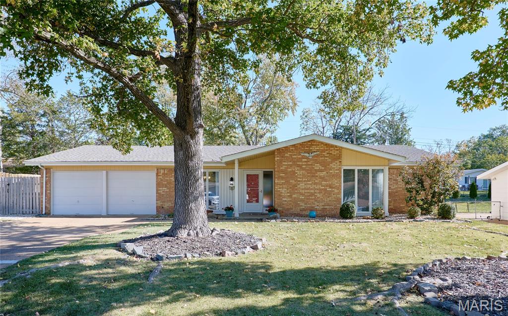 BEAUTIFUL MID CENTURY VIBE! The perks of owning a home with no basement is you get over 2100 square feet of easy living all on one floor! Situated in beautiful Ballwin, Parkway West School District, Shopping, Restaurants and easy access everywhere! This is a true four-bedroom, two full bath home. The large living room shows as an extra bedroom but it can also work great for a sunlit office/flex or play room. Large laundry/mud/bonus room with slider to rear yard has so much potential as well. Updated eat-in kitchen has ample cabinets/pantry area. The primary bedroom has new carpet, an updated bath, walks out to the rear yard, and multiple closets. Light and bright everywhere you turn, neutral decor, usable fenced rear yard, two-car extra deep garage with extra storage and built-in shelves, . This wonderful home sits on a very friendly cul-de-sac!