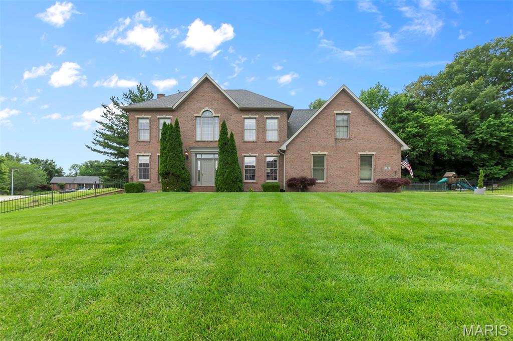 Tucked away on a cul-de-sac, this stately home offers space, function, and privacy in a beautifully manicured setting. Step inside to soaring ceilings and a thoughtful layout. The heart of the home is the kitchen, featuring custom cabinetry, an island, stainless steel appliances, a built-in desk, and a walk-in pantry, perfectly positioned between the breakfast room and formal dining room. The main level also includes a spacious living room with gas fireplace, a formal sitting room, and a laundry room with custom cabinetry, sink, and built-in ironing board. Upstairs, you'll find a large landing ideal for a home office, two additional bedrooms, a hall bathroom, and a massive primary suite with a private balcony overlooking the pool. The primary also features a huge walk-in closet and spacious ensuite bath. The walkout basement includes a large family room, full bathroom, bonus room that could easily function as a fourth bedroom, and plenty of storage. The oversized garage features stained floors and a workshop area. From the lush landscaping to the private backyard with an inground pool, this well-maintained home offers a quiet setting with room to live, work, and relax.