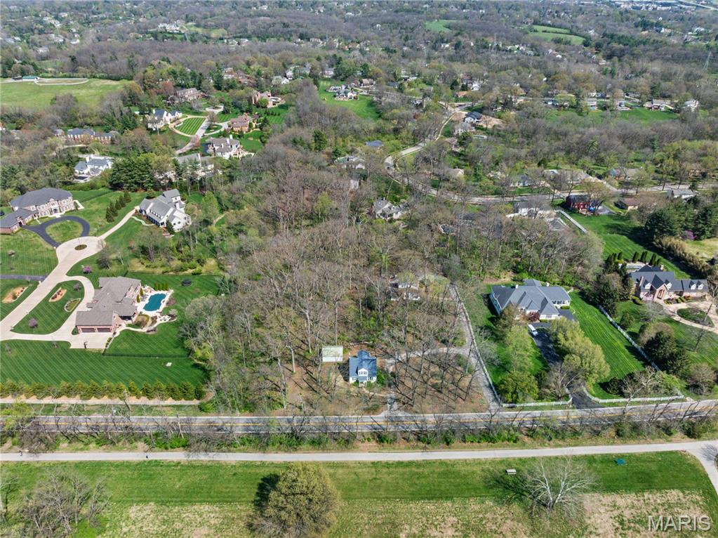 Back on Market - No Fault of Seller! | Outstanding opportunity to build your dream home on a 3.24 acre lot or to rehab the 2 existing homes on the property! The property is in the Estate Zoning District which means that each residential lot must be at least 1.8 acres, so it cannot be split. (The 2 homes on the property, front and back, are grandfathered in). Beautifully virgin wooded and very private. Being sold with existing homes "as is" but they have very livable utilities (gas, water, electric, sewer & cable). Front home (built in 1941, 1,344 s.f.) has 4 beds, 2 baths, living room, kitchen, & back porch w/ detached garage. Back home (built in 1973, 2172 s.f.) is 2 sty, 3 beds, 2.5 baths, living room, dining room, kitchen, family room, main floor office, 2 car garage. There is a 35' easement along the south property line for the asphalt driveway. Total frontage is 306 ft./470 ft deep. Homes are occupied. Do not walk or drive on the property without an appt. This is a duplicate listing:# 25021017