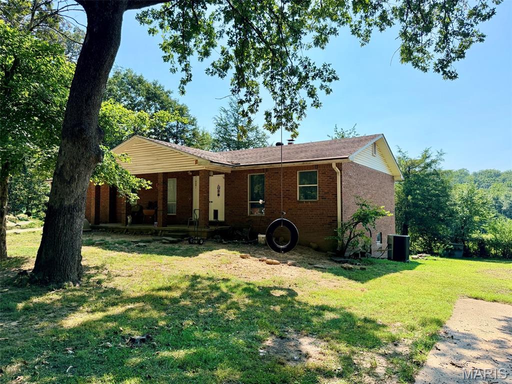 Beautiful brick home offering peaceful country living just minutes from Poplar Bluff! Situated on a private 1-acre lot surrounded by picturesque farm ground, this spacious home offers the potential for 4 bedrooms and 3 bathrooms, along with a full walkout basement providing plenty of room for a growing family. Numerous updates have been made throughout the home, blending modern touches with warm country charm. A beautiful real fireplace creates an inviting atmosphere, while the home is also equipped with a generator hookup for backup power (generator not included). Step onto the back deck in the evening and take in gorgeous golden-hour views across the neighboring hayfield, where wildlife is a common sight. With plenty of space, privacy, beautiful surroundings, and the convenience of being only minutes from town, this one-of-a-kind property offers the best of country living without sacrificing convenience.