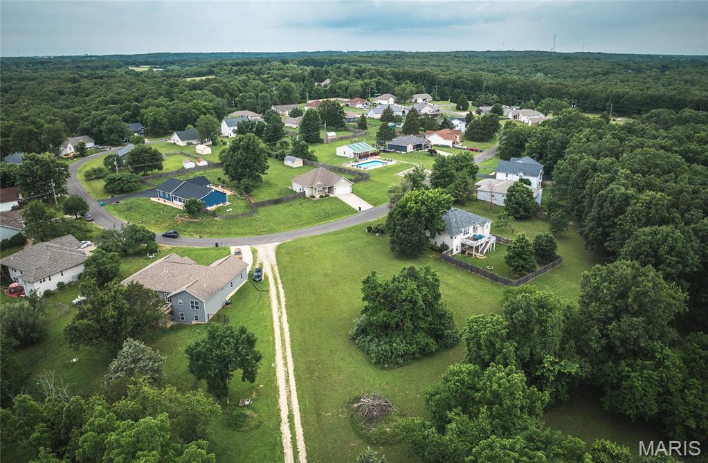 Discover the perfect place to build your dream home on this beautiful 1.11-acre residential lot nestled within an established community that offers both privacy and convenience. Surrounded by mature surroundings and a peaceful atmosphere, this level homesite provides the ideal setting for creating a home that reflects your lifestyle while enjoying the benefits of a welcoming neighborhood.

Imagine starting your mornings with coffee on a future back patio, spending afternoons enjoying the community amenities, and coming home each evening to your own private retreat. Residents enjoy access to a community pool and clubhouse, creating opportunities to relax, connect with neighbors, and make the most of every season without leaving the neighborhood.

The lot itself offers a rare combination of usable space and privacy. With level terrain and utilities readily available, you'll have a head start on bringing your vision to life, whether you're planning a custom-built home, a spacious outdoor entertaining area, or a quiet sanctuary surrounded by nature.

Finding a homesite that combines community amenities, a private setting, and build-ready convenience is becoming increasingly difficult. This property offers the freedom to design the home you've always wanted while enjoying the comfort and amenities of an established neighborhood.

Don't miss this opportunity to secure one of the area's most desirable homesites. Bring your plans, your builder, and your imagination—then schedule a visit today and see why this 1.11-acre lot could be the perfect foundation for your future dream home!