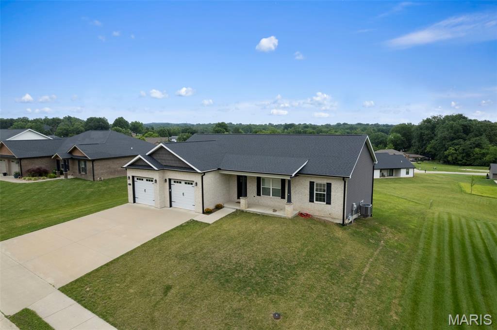 Built in 2020, this beautiful 4-bedroom, 3-bath ranch home offers modern comfort and a highly desirable open floor plan. The spacious kitchen
features a large island perfect for gathering and entertaining, while the convenient main-level laundry adds everyday ease. Enjoy generous
living spaces, comfortable bedrooms, and a versatile John Deere room ideal for storage, a workshop, or hobby space. Move-in ready and
thoughtfully designed, this home combines functionality and style in a welcoming ranch layout.