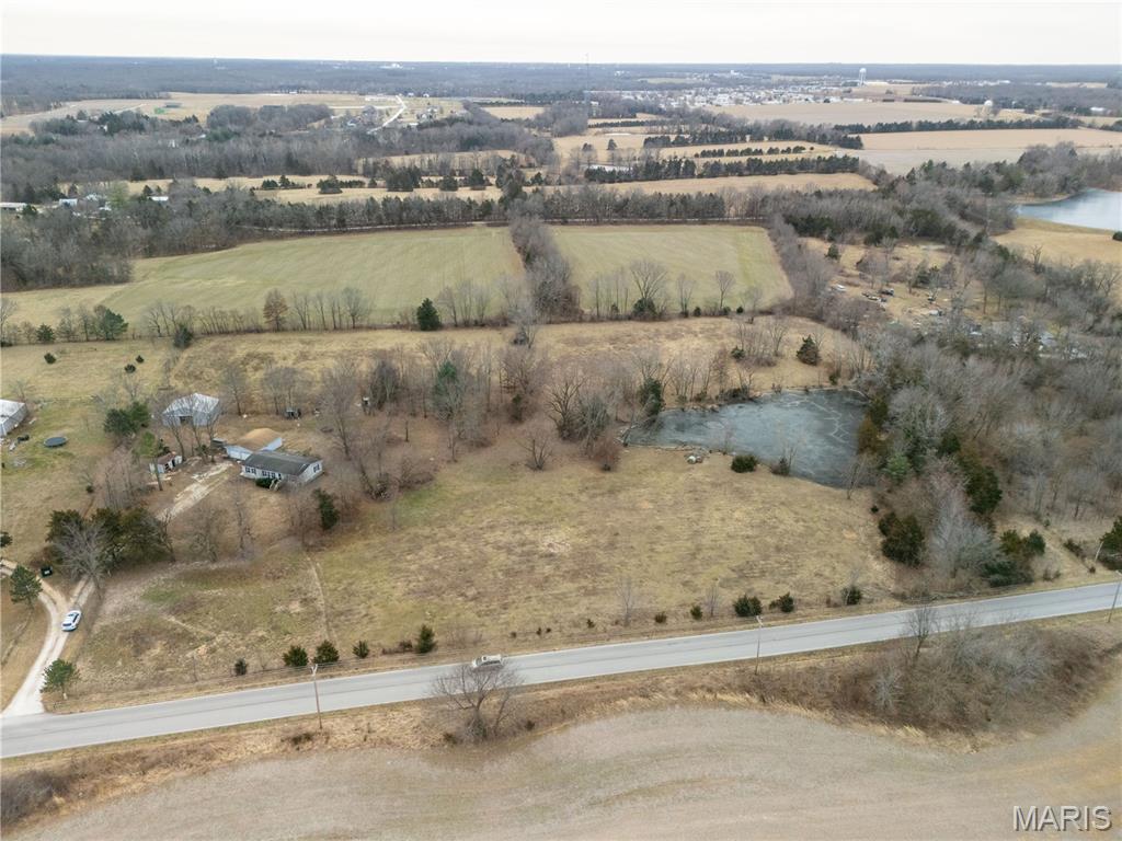 Surveyed 4.71 acre agricultural tract located just minutes from Warrenton with convenient access to major highways and approximately 45 minutes to St. Louis. The property features gently rolling topography, partial fencing, county road frontage, and a well-established pond set back from the road, providing privacy and a natural focal point for a future homesite.
The seller has completed key upfront work to streamline the build process, including a completed survey, professional septic design, and available quotes for septic installation and well drilling. No HOA and not located in a flood plain.
Suitable for a custom home, weekend retreat, or land investment.
See MLS listing 26019421 for To Be Built home by seller on property