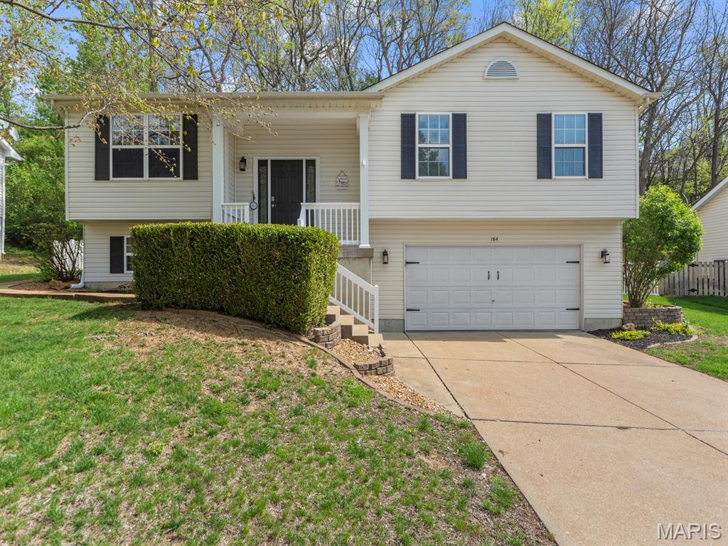 Welcome home to this truly one-of-a-kind split-level gem in the highly desirable Winter Valley neighborhood!  Offering 3 bedrooms and 2.5 baths, this home perfectly blends comfort, functionality, and a great entertaining space.  The main level features vaulted ceilings and beautiful, durable stranded bamboo floors that flow seamlessly from the spacious living room into a chef-inspired kitchen.  
 The kitchen boasts top-of-the-line upgrades, including 42" maple cabinets with soft-close doors, crown molding, roll-out shelves, spice racks, a floor-to-ceiling pantry, an oversized island with breakfast bar, built-in desk, granite countertops, glass tile backsplash, and built-in stainless steel appliances under recessed lighting — ideal for both daily living and entertaining.  The living room impresses with vaulted ceilings and a wood-burning fireplace with stone and granite surround, creating a warm, inviting centerpiece.  The bamboo flooring continues into the primary suite which includes an adjoining bath with dual-sink vanities.  Two additional bedrooms and an updated hall bath complete the main level.

The finished lower level adds versatility with a large family room/rec area featuring a fireplace wall feature, built-in bookcases, dry bar, half bath, and laundry room.  This home also offers valuable updates and features including a 40-gallon water heater (2024), HVAC system (2020), an oversized garage with extra storage or workspace potential, and an inground irrigation system to keep your lawn looking its best.  Enjoy a fully fenced backyard and inviting patio that provides privacy and plenty of room for entertaining, pets, or play.  With its thoughtful designer finishes, functional layout, and prime location, this home truly has it all and won’t last long!