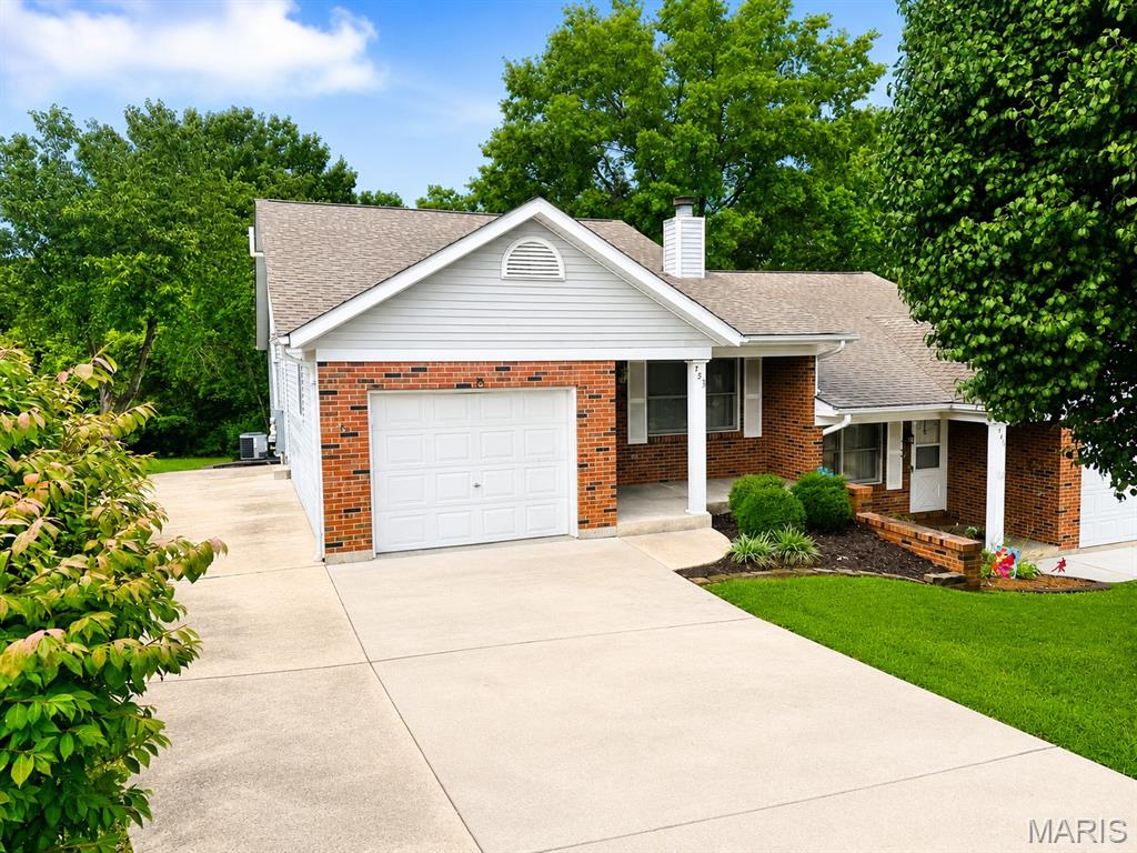 Welcome home to this well-maintained 2-bedroom, 2-bath condominium offering 1,140 square feet of comfortable main floor living space plus a finished walk out lower level in one of Washington's most convenient locations for a total of approximately 1840 square feet of total living space!  This home features an inviting living room with a cozy fireplace, main-floor laundry hookups, and an attached one-car garage.

The finished walkout lower level with full bathroom adds exceptional flexibility and could easily serve as a third bedroom, guest suite, home office, or recreation room with its own private entrance. Step outside to enjoy a spacious backyard that backs to mature trees, providing privacy and a peaceful setting rarely found in condominium living.

Additional features include a concrete driveway with extra off-street parking, attractive mature landscaping, all-electric appliances and central heating, and the added benefit of no HOA fees—an increasingly rare opportunity for a condominium.

Conveniently located in the heart of Washington, you'll be just minutes from parks, walking trails, schools, the YMCA, shopping, dining, and other local amenities. This move-in-ready home offers the perfect combination of comfort, convenience, and value. Schedule your private showing TODAY!