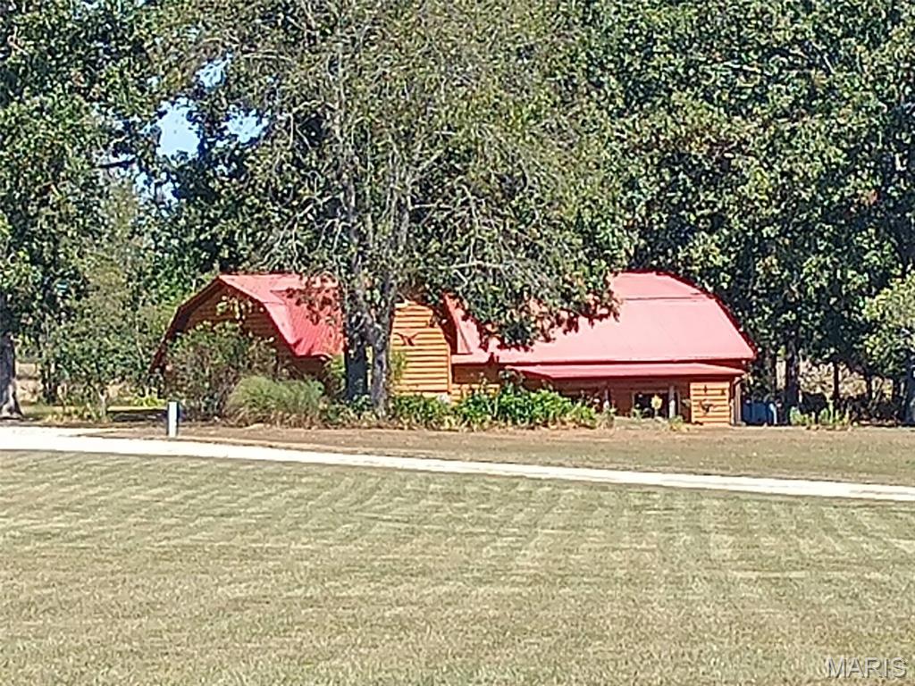 Beautiful Custom Home with open concept and  beautiful kitchen and cabinets, Loft bedrooms and bath in loft with a Jacuzzi and step in shower.  Home has 1,834 square feet as per the Assessor. Has a 12 x 20 barn/storage and other outbuildings. Has shared driveway. Located on a chip and seal road just .8 of a mile off of Highway 19 North. Just minutes from City Limits.  Low utilities and no known restrictions and has R-4 and R-80 School districts. Make your appointment to see this really great property.