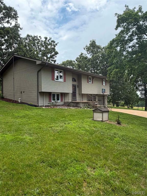 Located just 10 minutes from Highway 60 and Mountain Grove, this 4-bedroom, 2-bath home sits on 10 acres M/L and offers approximately 1,800 square feet of living space, with additional acreage available. The mostly open land provides scenic views, privacy, and plenty of room to enjoy country living. Inside, you'll find an updated kitchen and a freshly renovated finished basement, offering flexible space for family, guests, or entertaining. Central heat and air provide year-round comfort, while a wood-burning heat source in the basement adds efficiency during colder months. The attached two-car garage features workbenches and a utility sink with hot and cold water while still providing ample room for vehicles. A detached workshop offers additional space for projects, storage, or equipment. The master bedroom opens onto a private deck, creating the perfect spot to relax and take in the surrounding countryside. Spacious front and back yards provide endless opportunities for recreation, gardening, or simply enjoying the peaceful setting. Additional acreage available has own power and access off King Road.