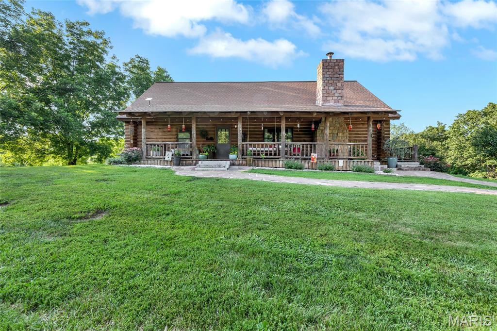 Welcome to one of the most extraordinary and truly one-of-a-kind properties you will ever have the opportunity to own! Nestled on 47.61 breathtaking acres of scenic wooded land in Waterloo bordering conservation grounds, this incredible log cabin retreat offers a rare combination of rustic charm, modern comfort, and unparalleled privacy that is simply impossible to replicate.
From the moment you turn onto the private mile-long driveway — lined with 50 feet of clearance on either side for future widening — you'll know this property is something truly special. The cleared area surrounding the home provides a beautiful and serene front and back yard, while the surrounding wooded acreage is home to an incredible variety of fruit and nut trees including apple, cherry, pecan, pear, chestnut, and more — a nature lover's paradise in every sense of the word!
Step onto the charming covered front porch and into the warm and inviting log cabin, where the spacious family room immediately captures your heart with its large windows offering scenic views, soaring vaulted ceiling adorned with gorgeous wood beams and a stunning wood burning fireplace with insert — the perfect gathering spot for family and friends on cool evenings. The well-appointed kitchen features ample cabinet storage, ceramic flooring, a pantry cabinet, and all appliances included, making everyday living both comfortable and convenient. Two generously sized bedrooms and a bathroom round out the main level.
Head upstairs to discover the private third bedroom retreat, complete with a walk-in closet, a full bathroom, and a wonderful loft area — the perfect space for reading, relaxing, or simply taking in the beauty of the surrounding property.
The outdoor living spaces of this property are nothing short of extraordinary. The sprawling wrap-around deck — partially covered for year round enjoyment & the incredible 2,100 square foot patio & a hanging day bed create the ultimate outdoor living experience. Whether you're hosting gatherings, stargazing on a clear night, or simply soaking in the peaceful surroundings, this outdoor space delivers in every way.
But wait, there's more. This property also features a 30' x 40' outbuilding perfect for storage, hobbies, or equipment, a charming chicken coop for the hobby farmer, and the crown jewel of this incredible estate — a stunning 1,500 square foot treehouse w/ heat/AC & plumbing (has it's own septic tank). Complete with a family room, full bathroom, kitchenette, a loft area, & deck, this treehouse is truly a destination in itself — perfect for guests, a vacation rental opportunity, or simply the most incredible backyard retreat imaginable!
Additional highlights include Starlink internet service in both the home and treehouse, a tankless water heater & a well with holding tank ensuring modern comfort and connectivity in this remarkable off the beaten path retreat.
With its unmatched combination of acreage, privacy, rustic charm, and incredible amenities, 1981 KK Rd is a once in a lifetime opportunity that truly has to be seen to be believed. Schedule your private showing today — properties like this simply do not come along very often!