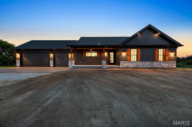 ON THE SOUTHSIDE!  Custom-Built New Construction on 4.09 Acres with a Pond! Experience the perfect blend of modern luxury and peaceful country living in this stunning custom-built 1,810 sq. ft. ranch home with a full walk-out basement, situated on 4.09 scenic acres complete with a private pond. Step inside to an open-concept floor plan featuring soaring ceilings, luxury flooring, and abundant natural light. The show-stopping kitchen is designed to impress with 42-inch custom black cabinetry, elegant gold hardware, quartz countertops, a striking custom subway tile backsplash, oversized center island, and stainless-steel appliances including range, hood, dishwasher & undermount microwave—making it the heart of the home. The spacious primary suite offers a private retreat, while the additional bedrooms provide comfort and flexibility for family or guests. The unfinished walk-out basement is ready for your personal touch, offering endless possibilities for additional living space, recreation, or storage. Enjoy breathtaking views from the covered deck or entertain on the expansive patio just outside the walk-out basement, overlooking your beautiful acreage and tranquil pond. 3 car garage is insulated and drywalled & has insulated garage doors. With quality craftsmanship, timeless finishes, and plenty of room to roam, this home offers the best of new construction in a picturesque setting. Don't miss your opportunity to own this exceptional custom home where luxury, functionality, and country charm come together.