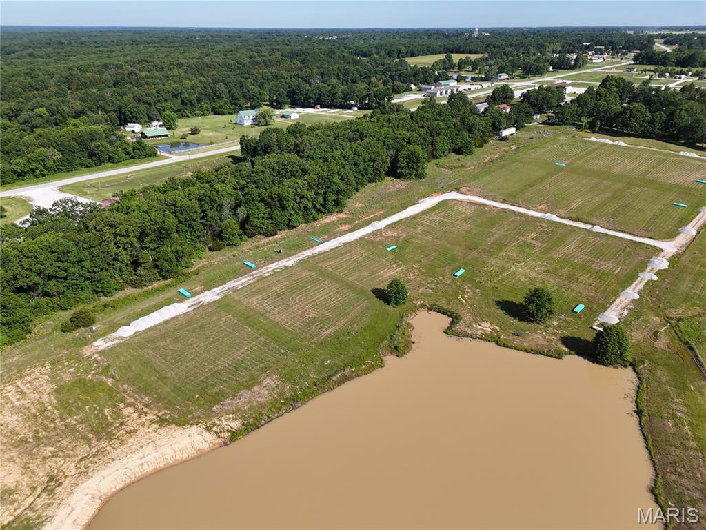 Welcome to Lot 188 in Phase 2 of Adventure Out RV Park! This spacious .75-acre pond-front lot offers a beautiful setting to create your own seasonal retreat while enjoying peaceful water views and everything the Mark Twain Lake area has to offer. With construction underway, now is the perfect time to secure your lot and begin planning your seasonal retreat.
Design your seasonal getaway with a custom RV pad, outdoor living space, fire pit area, and other approved improvements to make it your own. Water, sewer, and electricity will be available at each lot. High-speed fiber internet service is available through Ralls Technologies and can be installed at each lot, making it easy to stay connected while enjoying the outdoors.
Owners may construct one storage building per lot, with a maximum size of 3,000 square feet, subject to the Declaration and Declarant approval, providing ample space for your RV, boat, camper, golf cart, and recreational equipment.
Phase 2 offers a variety of lot options to fit every preference, including pond-view, waterfront, wooded interior, and larger estate-style lots. Lot sizes range from approximately .28 of an acre to .75 of an acre with prices starting at $55,000.
Contact the listing agent for current availability, the subdivision plat, restrictions, utility information, and available lot locations. Don't miss your opportunity to own one of the development's largest pond-front lots in Phase 2 of Adventure Out RV Park, just minutes from beautiful Mark Twain Lake.