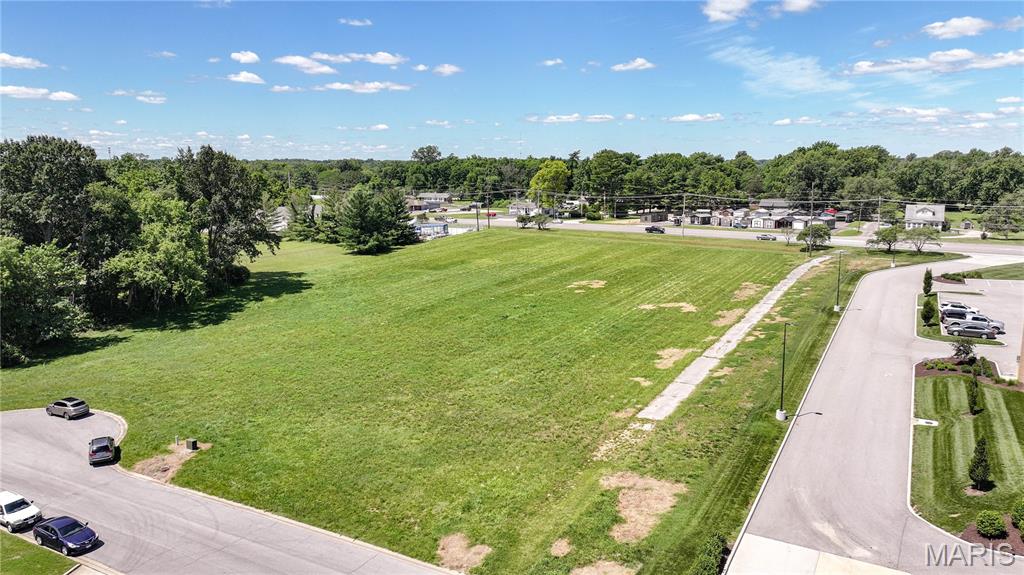 Exceptional investment and development opportunity off of the highly traveled Godfrey Road. This B-4 zoned commercial parcel offers outstanding visibility, strong traffic counts, and a strategic location within an established commercial corridor.
Surrounded by complementary businesses including financial services, convienant care center, and dental offices, the property benefits from consistent daily traffic and a built-in customer base. The flexible B-4 zoning supports a variety of commercial uses, providing investors and developers with multiple pathways for value creation.  
Whether you're planning a retail center, medical office development, professional office complex, restaurant, or other commercial venture, this site offers the location, exposure, and accessibility needed for long-term success. With commercial growth continuing in the area and limited opportunities along this corridor, this property presents a compelling opportunity to develop, hold, or add to an investment portfolio.
Capitalize on the demand for well-positioned commercial real estate and bring your vision to one of the area's most visible development sites.