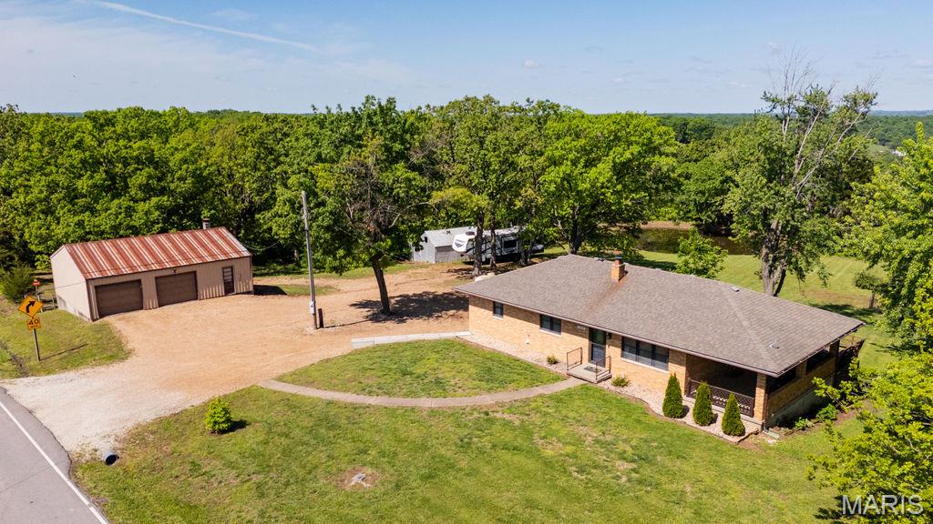 Located just outside of Westphalia in the highly sought-after Fatima School District, this extremely well-maintained 3 bed, 1.5 bath brick home offers the perfect blend of comfort, functionality, and country living. Completely remodeled in 2020, the home features 1,170 square feet of living space with updated finishes throughout, including a beautifully designed kitchen with all new stainless steel appliances. Laundry hookups are conveniently located on both the main level and in the full basement, offering flexibility to suit your needs.

Situated on 3.96 acres, this property provides plenty of space to enjoy the outdoors, complete with a small pond perfect for fishing with the kids. Entertain or relax on the concrete patio or wooden deck while taking in the peaceful surroundings. The 30'x40' shop with concrete floors and electric is a standout feature, offering two garage spaces plus a full basement area with an additional parking space, ideal for storage, hobbies, or workspace. With state highway frontage and a prime location just 20 minutes to Jefferson City and 45 minutes to Columbia, this property offers rural charm with convenient access to town. This one won't last long! Call for your showing today!