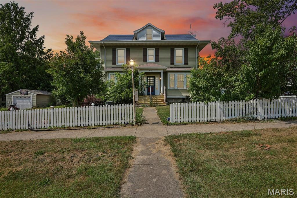 TIMELESS CHARACTER, incredible space, and endless potential! Step into this stunning historic home where original craftsmanship meets opportunity. From the moment you enter, you'll be captivated by the gorgeous original woodwork, coffered ceilings, hardwood floors, built-in window seats, French doors, and beautiful architectural details that are nearly impossible to find in newer homes. The main level offers multiple spacious living and entertaining areas, including formal living and dining rooms, a large kitchen with abundant cabinetry, a bright sunroom, and an oversized bonus room that could easily become a family room, game room, home office, or a primary bedroom suite. Upstairs, you'll find generously sized bedrooms filled with natural light and plenty of room to spread out. The walk up attic has freshly added insulation. This home has already seen several updates, including vinyl siding, solar panels, mini-split systems, floor heat, a partially finished bonus room in the basement, and many replacement windows. A fenced yard, detached garage, and inviting front porch complete the exterior. While some finishing touches and cosmetic updates remain, this home offers an incredible opportunity to build equity and restore a true classic to its full glory. Whether you're looking for a spacious family home, a unique bed & breakfast opportunity, or simply appreciate the beauty of historic architecture, this property is one you won't want to miss.