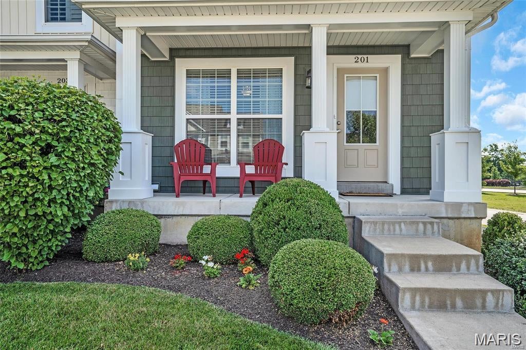This like-new end unit is picture perfect! Bright, open and modern. Natural light pours in through the large windows; hickory flooring runs throughout. Crisp, fresh paint - gorgeous! Fabulous kitchen features 42" shaker style cabinets, tile backsplash and ample counter space enhanced by breakfast bar. Stainless steel appliances with 5 burner gas range. Main floor washer/dryer. Upstairs features loft area, 2 spacious bedrooms and 2 baths. Romantic master suite with walk-in closet & private bath. Unfinished basement offers great storage. Outdoor space includes patio, extra green space and a view of the pool. Great architecture and an unbeatable location just minutes from top schools, shopping and highways. Enjoy the playgrounds, basketball & sport court. Walk the trails, relax at the pool - there is even a picnic area! Rent covers all of the above, plus trash, landscaping and snow removal. Up to two dogs ok for additional $25/month/dog. No cats. No smoking. Location: End Unit