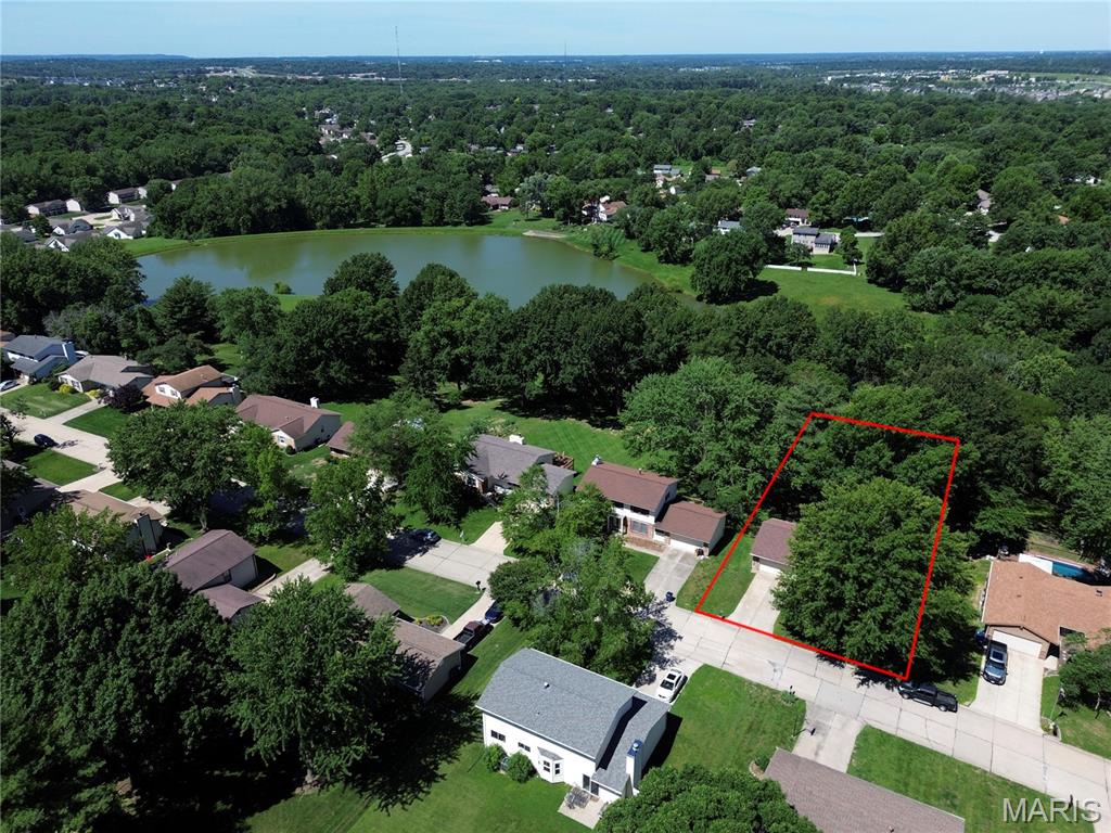 This one checks all the boxes—location, lake view, walkout lower level, and direct lake access right from your backyard! This beautifully maintained 4BR/2BA home offers approximately 2,500 sq. ft. of finished living space, including 1,768 sq. ft. on the main level. Enjoy relaxing on the deck overlooking the lake and taking in the peaceful views from your spacious backyard. Inside, you'll find luxury vinyl plank flooring throughout the main living areas, a cozy gas fireplace, vaulted ceilings, main floor laundry, an eat-in kitchen with breakfast bar, and a separate dining area. The partially finished walkout lower level provides additional living space while still offering abundant storage with shelving, a workbench, and a separate room perfect for an office, hobby, or craft room. Recent updates include flooring, paint, light fixtures, and more. Move-in ready and waiting for a new family to fall in love with everything this home has to offer!