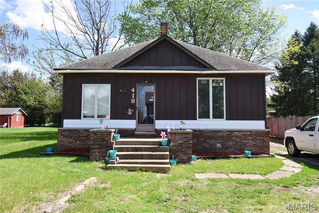 UNLOCK THIS HOME'S POTENTIAL! This 2-bedroom home in Gillespie offers a great chance to build equity with several key updates already started. Recent improvements include updated electrical work and new PEX water lines, giving you a solid foundation to continue bringing this property to life. Step inside and you’re welcomed by a spacious living room, with a well-sized bedroom just off the main area. Both bedrooms offer comfortable space and flexibility. The kitchen features a functional layout with ample storage, making it practical for everyday use. A nearby closet presents an excellent opportunity to be converted into a laundry area and potential half bath. The basement provides convenient access to the home’s mechanical systems along with additional space for storage. Step outside and enjoy one of this property’s true highlights—a large, shaded backyard offering the perfect setting for relaxing, entertaining, or future expansion. The home also features convenient front yard parking with turnaround space, a rare and practical bonus. A covered back porch provides a comfortable spot to unwind, while the outdoor water spigot and electrical outlet add everyday functionality and versatility to the space. Whether you're searching for your next investment, a flip, or a place to truly make your own, this property offers the perfect opportunity to build equity and bring your vision to life. Don’t miss your chance—schedule your showing today and see the potential for yourself!