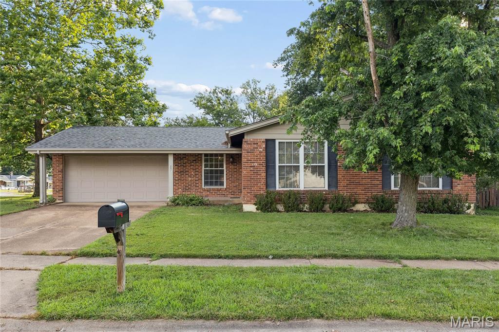 Have you been looking for a great opportunity to purchase a ranch style home in a highly desirable neighborhood and located in the highly rated Rockwood School District? This home offers the perfect chance to build value with a little sweat equity while enjoying a wonderful setting close to schools, restaurants, and shopping. The total living area is 2249 SF, the  main level features 1,374 square feet with hardwood floors throughout the main common living areas, a kitchen with white cabinetry and granite countertops, and is open to the hearth room with a cozy fireplace. Atrium doors lead from the hearth room to the screened porch, creating an inviting space to relax or entertain. There are 3 bedrooms and 2 full baths. The primary bedroom suite offers a private bath w/ shower and a walk- in closet The finished lower level adds even more flexibility with a rec room ideal for gatherings, hobbies, a home office, or additional everyday living space. In addition, there is a two-car garage and the yard is fenced. **HVAC and 50 gallon hot water heater new in 2024., new microwave. ** Enjoy the benefits of a sought-after subdivision with a pool and clubhouse, plus an unbeatable location and value. Don’t wait to make this home your own—this is truly one of the best values in the area. Sellers have never occupied the property and this property is being sold "as is". HURRY! This is an incredible opportunity.