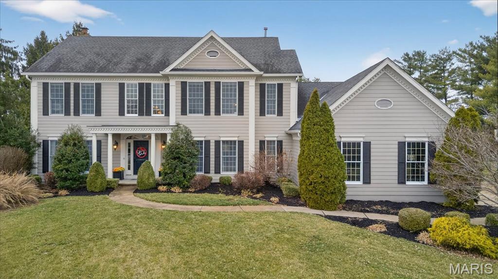 This stunning 5-bedroom, 4.5-bath Colonial is perfectly situated on a .56-acre cul-de-sac lot in the highly sought-after Stonebriar neighborhood, one of the larger lots in the community. A dramatic two-story foyer welcomes you with a curved split staircase and exquisite custom millwork and molding. Rich hardwood floors flow throughout the main level. The heart of the home is truly the kitchen-designed to impress and built for gathering. A spectacular 12-foot island anchors the space, complemented by a show-stopping hood, professional-grade Viking range with double ovens, custom cabinetry, and a new Sub-Zero refrigerator(2021). The adjoining vaulted hearth room offers warmth and charm with a gas fireplace, while a built-in planner’s desk and cabinetry provide everyday functionality. The living room features its own gas fireplace, creating an inviting setting for entertaining or relaxing with a beautifully updated bar offering a stylish and convenient space for hosting gatherings or enjoying a quiet evening cocktail.
An updated main-floor laundry and mudroom lead to the spacious three-car side-entry garage where you will find an electric car charger.  Upstairs, the expansive primary suite features tray ceilings and a large walk-in closet thoughtfully designed with a built-in yoga studio, creating a private wellness retreat right at home. The spacious en suite bath includes a jetted soaking tub, separate shower, and dual vanities. Two bedrooms share a Jack-and-Jill bath, and a fourth bedroom enjoys its own private full bath. The deep-pour newly carpeted lower level offers even more living space, including a fifth bedroom with adjoining full bath and egress window, ideal for guests or extended family. Additonal highlights include 2 new high efficency furnaces(2020), 1 new ac unit (2020), 1 new hot water heater(2020), new fence, 2 new sump pumps, new irrigation system, and new garage doors. This exceptional home seamlessly blends space, craftsmanship, modern updates, and lifestyle amenities in one of the area’s most desirable neighborhoods.