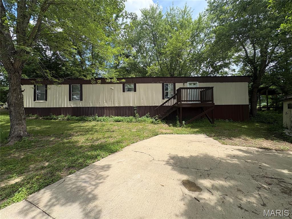 Embrace the ultimate waterfront lifestyle with this fantastic recreational property featuring both lake and river access! This 2-bedroom, 2-bathroom manufactured home will need some tender love and care but provides a comfortable retreat and concrete driveway. Enjoy exclusive access to the scenic Gasconade River, featuring a boat ramp and a gravel bar -- ideal for fishing, boating, or just soaking up the sun! Take advantage of excellent community perks, including a refreshing swimming pool, a kitchen, a spacious pavilion, and several shared common areas around the lake. A dedicated group of community volunteers host engaging events and social gatherings tailored for both children and adults. If you have been searching for a peaceful, laid-back haven just a short drive from Hermann, this welcoming community is exactly what you need!
