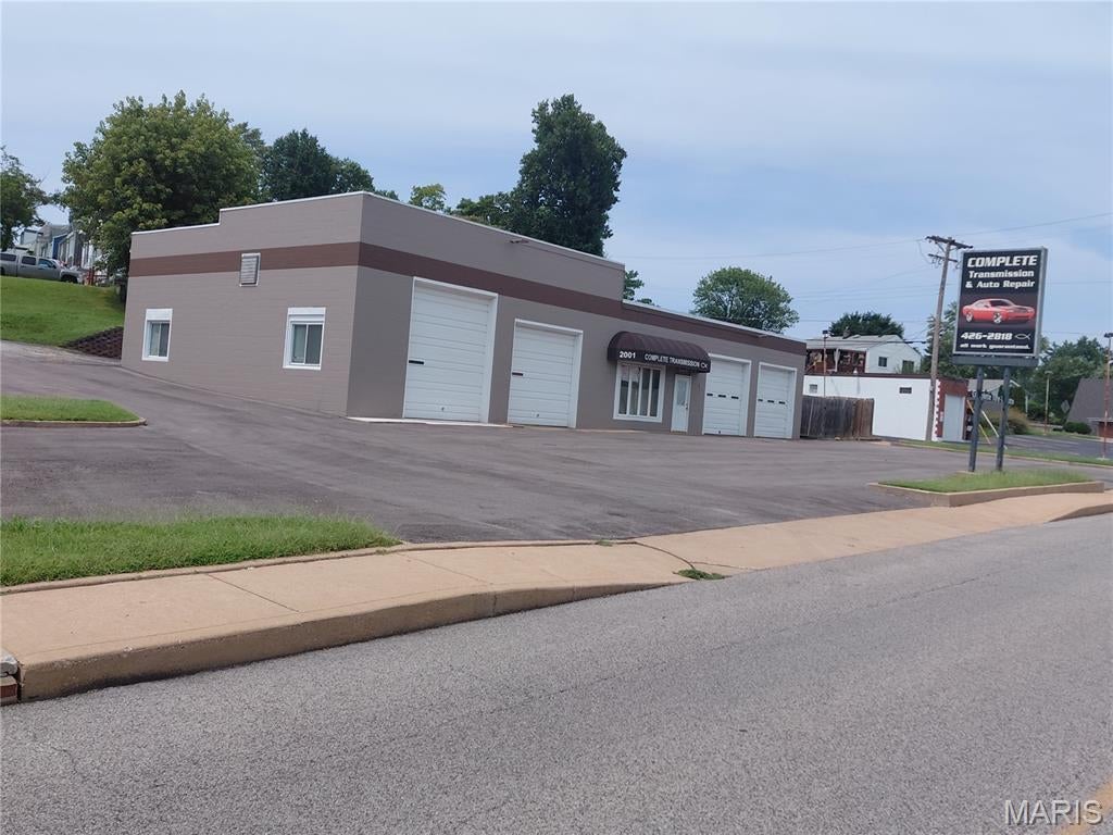 Below appraisal! Opportunity knocks for an auto tech or alternative use on this highly visible and well-located property. Was last run for many years as a successful transmission and tire repair shops. All equipment and tools of the trade stay with the property.

Great for an auto start up or an experienced operator.

This property could easily be used for other retail purposes. This property is being sold "As Is" seller to make no repairs. No seller's Disclosure will be made available. Roof on 2011 Woodson needs to be replaced, owner said she had bid for 10k+-.