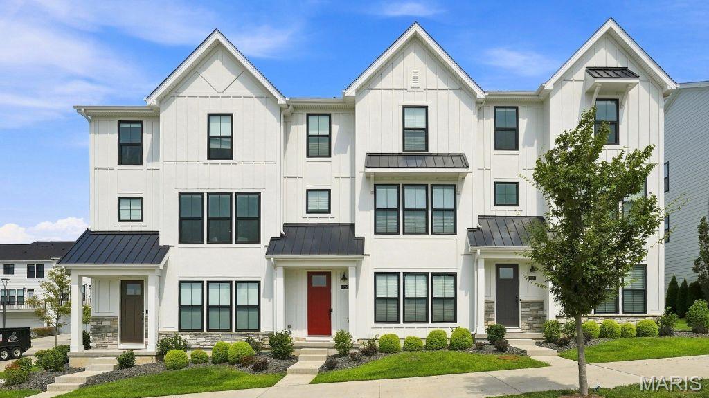 Welcome to effortless luxury living in the highly sought-after Townhomes at Wildhorse Village! Built just two years ago, this stunning Fischer Homes Clifton floorplan offers the perfect blend of modern design, upscale finishes, and low-maintenance convenience. Better than new, this move-in-ready townhome features over three levels of thoughtfully designed living space with 3 spacious bedrooms, 3 full baths, and 1 half bath. The heart of the home is the light-filled open-concept main level, where the gourmet kitchen with a large pantry flows seamlessly into the dining area and expansive family room featuring a cozy fireplace and private deck—ideal for entertaining or relaxing. Upstairs, the luxurious primary suite offers a spa-inspired en-suite bath, in addition, there is a second bedroom and en suite and the convenience of second-floor laundry. One of the standout features that sets this home apart from others in the community is the private entry-level bedroom or office paired with a full bathroom. This flexible space is ideal for guests, a dedicated home office, or multi-generational living, while also providing an excellent opportunity for aging in place without sacrificing comfort or convenience.Enjoy the benefits of nearly new construction without the wait, all in one of Chesterfield's most desirable communities with shopping, dining, walking trails, and everyday conveniences just moments from your doorstep. Opportunities to own in Wildhorse Village are limited—don't miss your chance to call this beautiful home yours!